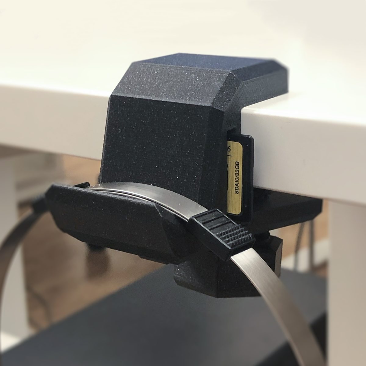 Headphone hook / SD card holder